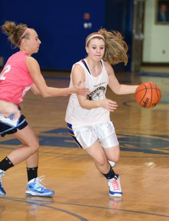 BOB FORD/TIMES NEWS Marian's Kaysi McLaughlin dribbles around Shenandoah Valley's Nina Norwich during last night's Schuylkill League Division III contest.