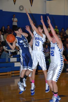 RON GOWER/TIMES NEWS Northern Lehigh's Josh Malaska (23) looks for help as Palmerton's Kyle Ruch (23) and Jourdan Reinhart (52) double team him.