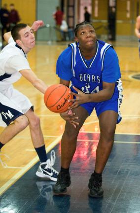 BOB FORD/TIMES NEWS @$:Pleasant Valley's Marquis Brown eyes up the hoop as Pocono Mountain West's Jake Boyle reachesin at left.