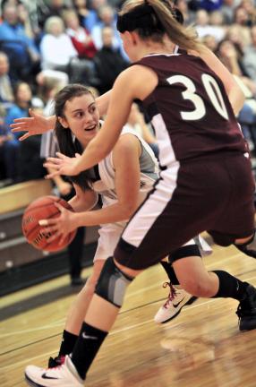 nancy scholz/times news Northern Lehigh's Tina Bastardi looks to escape the defensive pressure of Bangor's Brianna Bisci (30).