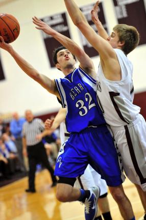 nancy scholz/times news Pleasant Valley's Nick Stanovick (left) goes up with a shot as Bangor's Ben Ammerman defends.