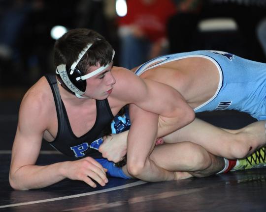 DON HERB/Special to THE TIMES NEWS Michael Dahlstrom of Pleasant Valley tries to get away from Blue Mountain's Brandon Choate in thneir 130-pound bout.Choate won by a 3-2 decision.