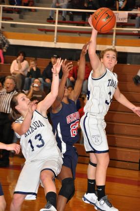 RON GOWER/TIMES NEWS Tamaqua's Ali Updike gets a hand onthe ball to keep it away from Jim Thorpe's Celeste Robinson as teammate Maria Streisel also helps.