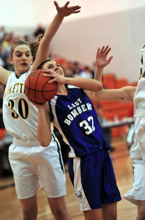 nancy scholz/times news Palmerton's Gina Farquhar (32) goes up with a shot against Central Catholic's Jenna Kocis.