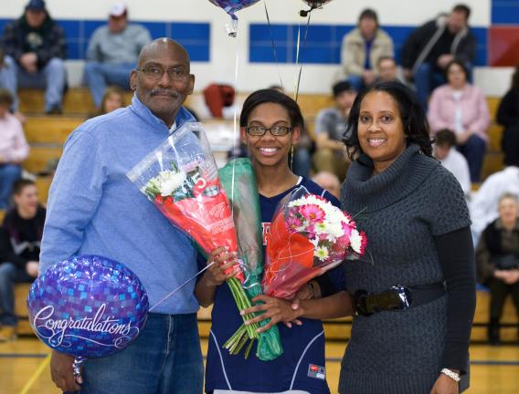 bob ford/times news Jim Thorpe's Celeste Robinson (center) is shown with her father Gabriel and her mother Paulette during a ceremony celebrating her 1,000th career point.