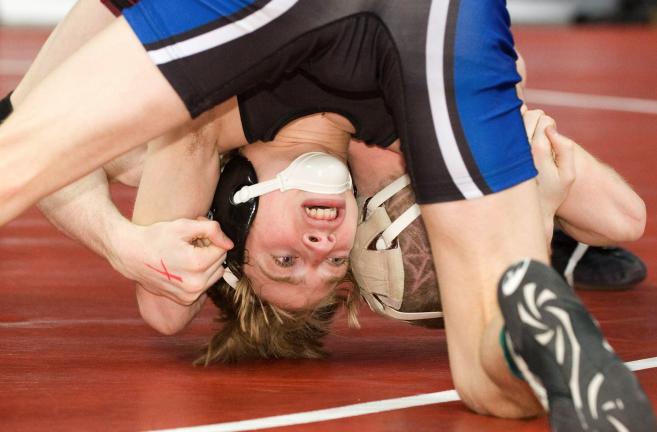 bob ford/times news Pleasant Valley's Kenny Yanovich battles Governor Mifflin's Colin Ocha in a 103-pound preliminary round bout in Class AAA.