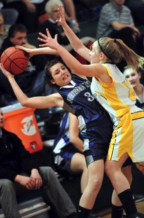 NANCY SCHOLZ/TIMES NEWS Kelsey Follweiler of Northern Lehigh (left) is pressure by Bishop McDevitt's Julie Kostic.