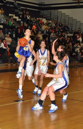RON GOWER/times news Danielle Tristani of Marian goes up for a shot as she drives to the hoop in Saturday's PIAA playoff game against Line Mountain.