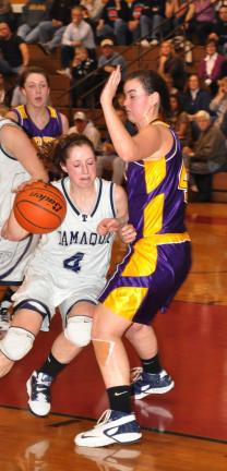 RON GOWER/TIMES NEWS Tamaqua's Kayla Hope drives around Scranton Prep's Liz Schultz on her way to the hoop.