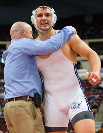 bob ford/times news Tamaqua's Garth Lakitsky gets a hug from assistant coach Greg Stewart after capturing a state title.