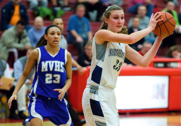 BOB FORD /TIMES NEWS Northern Lehigh's Aimee Oertner (33) looks for a teammate as Mid Valley's Alyssa Miraglia (23) looks on. Mid Valley defeated the Lady Bulldogs 46-41 in the PIAA Class AA Girls second round playoff game on Tuesday at Hazleton…