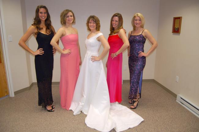 LINDA KOEHLER/TIMES NEWS Modeling some of the gowns donated for the fourth annual Prom and Wedding Dress Sale are, from left, Julianne Farina, BRC/Pencor Corporate; Cassie Borrell, Pencor Corporate; Erika Ahner, BRC/Pencor Corporate; Beth Winters,…