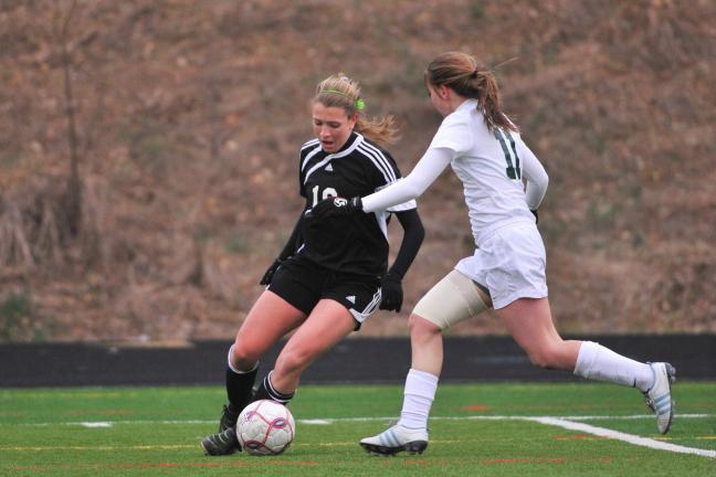 Nancy Scholz/Special to THE TIMES NEWS Kortney Graff (right) of Central Catholic moves in to try and take the ball away from Northwestern's Katie Hughes.