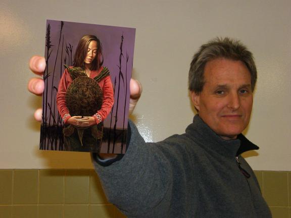 CAROL ZICKLER/SPECIAL TO THE TIMES NEWS Artist Victor Stabin holds a copy of one of his paintings, entitled "Christy and Tom."