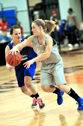nancy scholz/special to the times news Pleasant Valley's Kasey Meckes (right) pushes the ball up the floor. Meckes played for the Mountain Valley Conference.