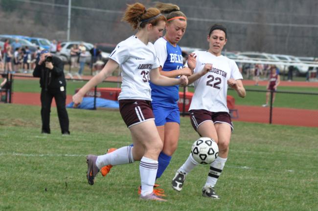 ron gower/times news Lehighton's Kristina Schnell (left) and Courtner Berger (right) race Pleasant Valley's Kira Sever to a loose ball.