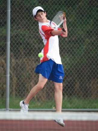 Bob Ford/TIMES NEWS Jim Thorpe's Corey Ligenza returns a shot during Tuesday's tennis match against Lehighton. Ligenza won his match to help the Olympians post a win.