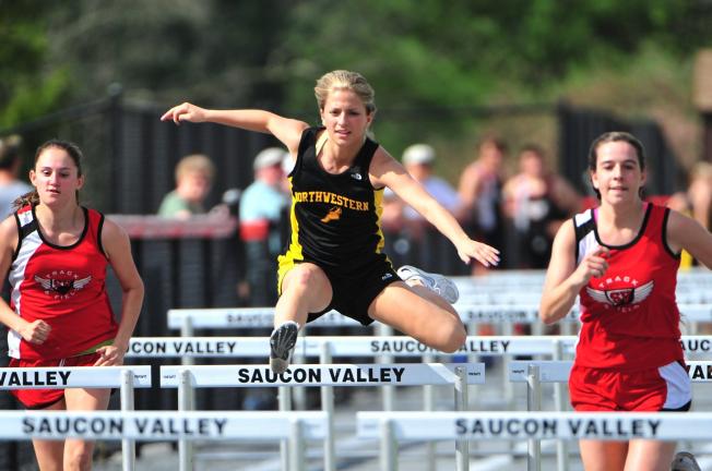 nancy scholz/times news Sam McLaughlin of Northwestern (center) clears the hurdle during a meet at Saucon Valley. The Panthers swept Northwestern, winning the boys meet, 86-64, and taking the girls meet, 95-65. No results from the meet were received…