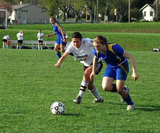 RON GOWER/TIMES NEWS Lehighton's Courtney Berger (22) battles for ball against Wilson's Alesha Seifert.