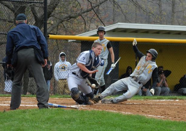 Ron Gower/TIMES NEWS Panther Valley's Thad Ogozalek slides safely into home behind Tamaqua catcher Matt Roberts in the Panther's four-run, third inning. Watching the action is the Panthers' Zach Stanko.