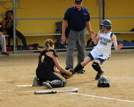 ron gower/times news Northwestern catcher Katie Williams blocks the plate and prepares to tag out Northern Lehigh's Meghan Weil.