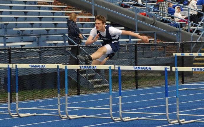 ron gower/times news Eric Herzog of Tamaqua won the 100 high hurdles against Minersville in a time of 15.6