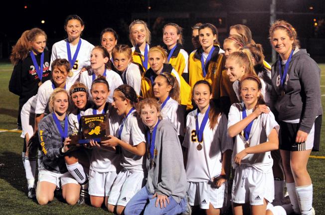 times news filephoto Northwestern players pose for pictures after winning the District 11 Class AA soccer championship in 2008. This year, the Tigers, as well all the other small school soccer teams, will have to compete in a one classification…