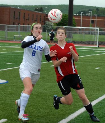 ron gower/times news Dana McAllister of Pleasant Valley, left, and Camille Roberts of Parkland both pursue ball.