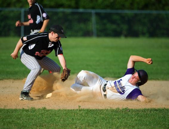 BOB FORD/TIMES NEWS Anthony Farole of the Franklin Township Shockers slides safely into second base as Zack King of the Panther Valley Black Diamonds goes to apply the tag.