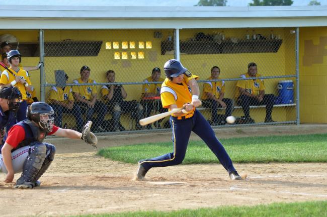 RON GOWER/TIMES NEWS Jake Kern of Northern Valley Legion swings at the ball and hits a single in game against Lower Macungie on Sunday. Later in the game, in the eighth inning, Kern scored on a wild pitch to give his team a 3-2 win.
