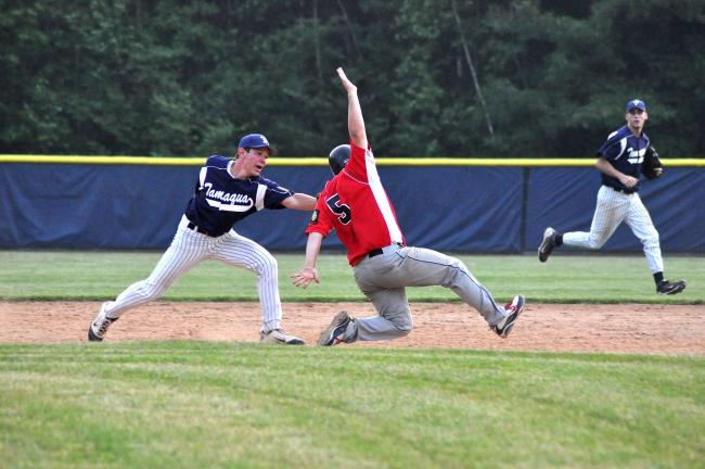 RON GOWER/TIMES NEWS Tamaqua shortstop Toby Rosen puts tag on North Schuylkill base runner who tried to get back to second base during Schuylkill/Berks Legion Baseball action yesterday.
