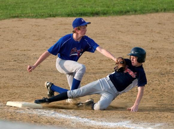 Jim Thorpe Bruins Shane Snisky tags out Brian Ohl of the Jim Thorpe Royals during Monday's Carbon Junior Babe Ruth Championship game. The Bruins won, 14-5. BOB FORD /TIMES NEWS