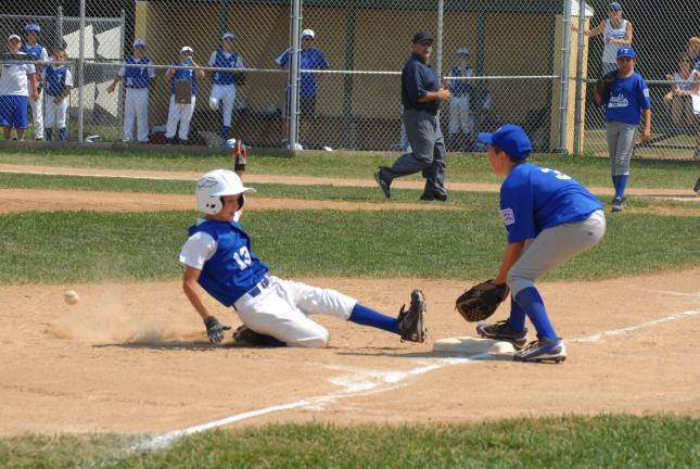 ron gower/times news Tamaqua's Josh Inama is safe at third base while Franklin Township third baseman Collin Haupt waits for ball.