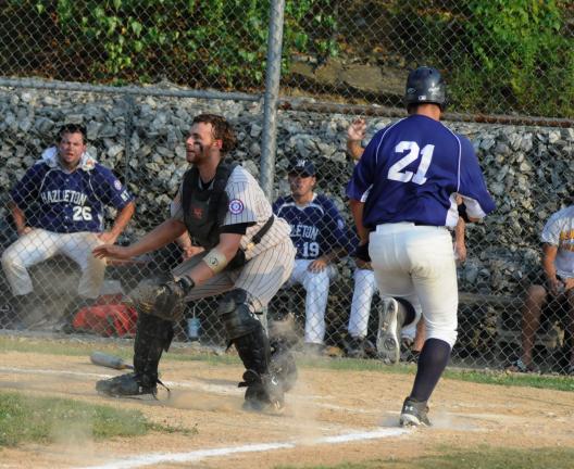 ron gower/times news Panther Valley Black Diamond catcher David Marouchoc waits for a throw as Hazleton's Mike Genasevica crosses the plate safely.
