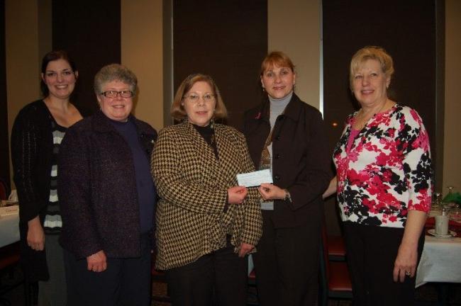 Gail Maholick/TIMES NEWS Lehighton Area Lioness Lions Club presented a check for $1,300 to Dolly Woody, executive director, of Susan G. Komen Foundation. From left are, Heather Raby, who assembled the Breast Cancer Awareness quilt; and Jane Heckman…