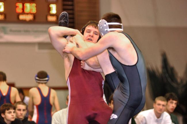 MIKE FEIFEL/TIMES NEWS Lehighton's Zach Coleman grabs the leg of Pennridge's Tom Roeder in the 160-pound match between the two teams at Saturday's Lehighton duals before recording a first period fall. Pennridge won the match 42-36.