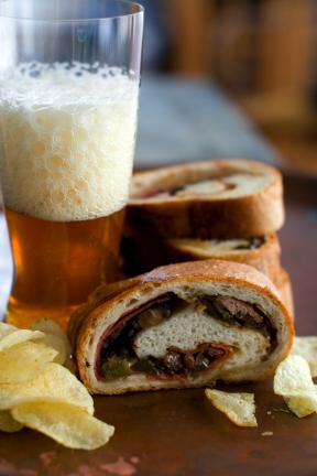 This Jan. 4, 2012 photo shows Super Bowl stromboli in Concord, N.H. To serve, stromboli are simply sliced like a loaf of bread, creating a spiral baked sandwich that is perfect for large parties. (AP Photo/Matthew Mead)