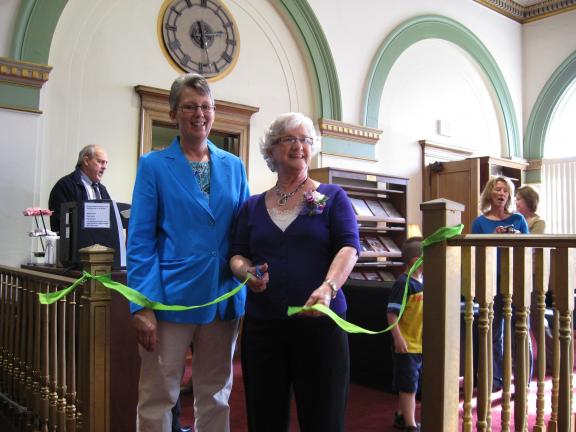 Above, Palmerton Area Library director Diane Danielson, left, and employee Dorothy Strohl during a ribbon-cutting ceremony at "The Strohl In," the library's new reading and laptop lounge. The lounge was named in honor of Strohl, who will retire this…