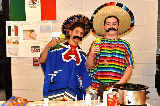 Looking like two Mexican Vaqueros, Hayden Lynd (left) and Johnathon Fickentscher helped educate visitors to their school's Multicultural Night about our neighbor nation to the South.