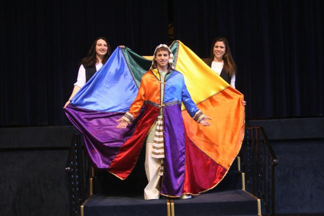 SPECIAL TO THE TIMES NEWS Stephen Valente as Joseph, and Miranda Milillo, left, and Joanna Butala as the narrators in Marian Catholic High School's production of Joseph and the Amazing Technicolor Dreamcoat, this weekend at the high school in Hometown.