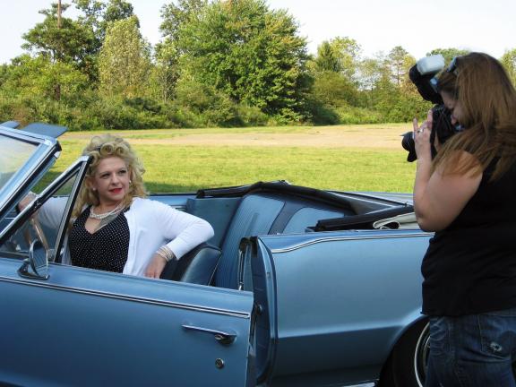 @$:Caption: Mary Gasker, left, poses during a photo session at the Mahoning Drive-In Theatre with Candice Kovalchick, the owner of CandyB Photography in Slatington. Gasker's newest hobby includes retro pin-up modeling, which mimics the grace and…