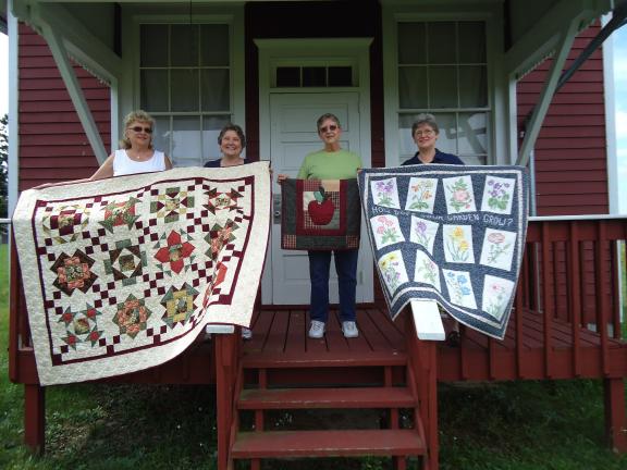 SPECIAL TO THE TIMES NEWS Preparing for the Historic Brainerd Church Festival are members of the Cranberry Quilt Guild, from left Judy Yeager, chairwoman; Debbie Kessell, guild president; Linda Webster and Betty Rosato. The guild will display…