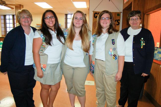 Gail Maholick/TIMES NEWS Taking part in the 100th Anniversary Alumnae Tea were, from left, Stephanie Rehnert, leader of Senior Girl Scout Troop 3802; Katie Hosler, Madeline Walbert, Stephanie Riggio; and Kathy Hosler, Lehighton Service Unit manager.