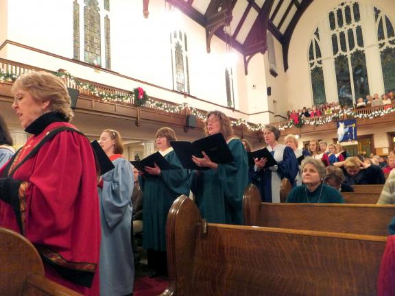 STACEY SOLT/SPECIAL TO THE TIMES NEWS Ecumenical Choir members line the aisles of Zion U.C.C. during the choral benediction.