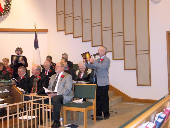 STACEY SOLT/SPECIAL TO THE TIMES NEWS Choir members Shirley Frantz, standing left, and Bob Keller perform a duet during the Ben Salem senior choir's annual Christmas cantata.