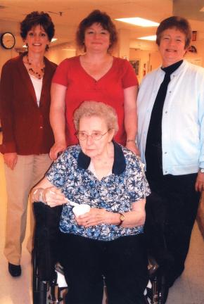 SPECIAL TO THE TIMES NEWS Julie Willet, Kim Ahner and Ann Louise Hayes are shown with Doris Matsinko, who is enjoying some ice cream while visiting with members of the LASD support staff.