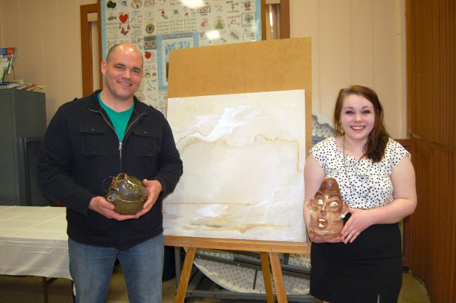 ABOVE: Mike Reenock, art teacher at Lehighton Area High School, holds a ceramic mug created by his student, Rowan Laitila, while she holds a sculpture. She also made the painting using black tea. BELOW: Young TNT dancers perform a ballet for the…