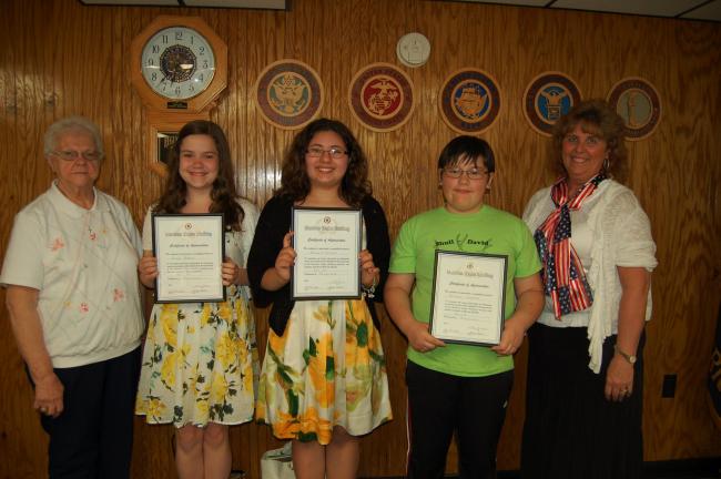 Gail Maholick/TIMES NEWS Winners of the Lehighton American Legion Auxiliary Unit 314 Americanism essay contest were recognized. From left are, Gladys Balliet, president; Emily Roberti, seventh grade, Tatiana Gonzalez, sixth grade, both students at…