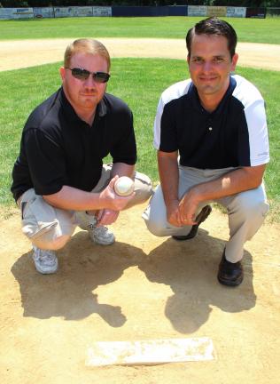 Marc Gallagher, left, of Tamaqua, and Steve Behr, of Andreas, reunite for a photo at the Tamaqua Little League field. Gallagher and Behr were part of the 1988 Tamaqua Little League team that put together a memorable run 25 years ago this summer.
