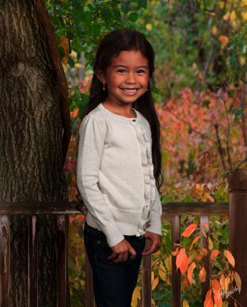 This 2013 publicity photo provided by Lifetouch School Photography shows a model posing for a school photo for Fall 2013 season. (AP Photo/Lifetouch School Photography)